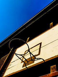 Low angle view of built structure against blue sky
