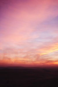 Scenic view of dramatic sky during sunset