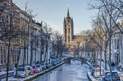 Delft church and canal in winter