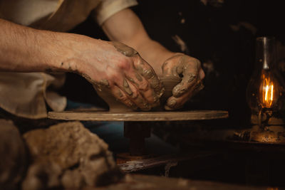 Man makes plate in pottery workshop, clay product, authentic atmosphere, background, footage. 