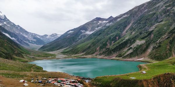 Scenic view of lake and mountains against sky