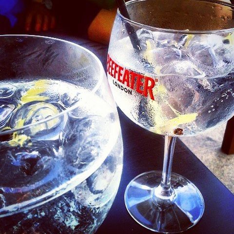 drinking glass, drink, food and drink, glass - material, indoors, refreshment, alcohol, close-up, still life, table, transparent, freshness, wineglass, ice cube, glass, no people, wine, ice, cold temperature, high angle view