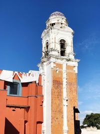 Low angle view of building against blue sky