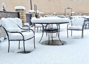 Empty chairs in snow