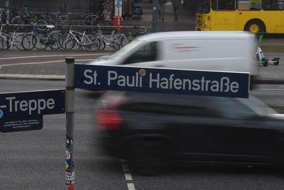 Close-up of car on road