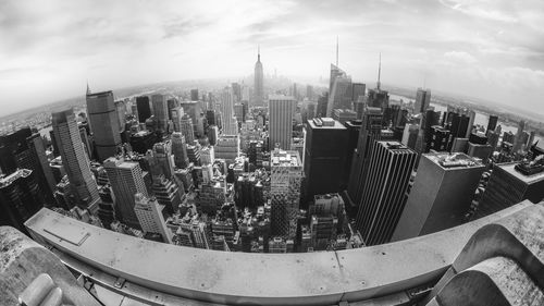 Cityscape against cloudy sky