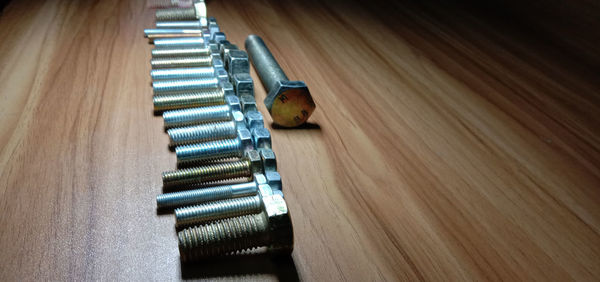 High angle view of piano on wooden table