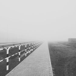 Empty road in foggy weather