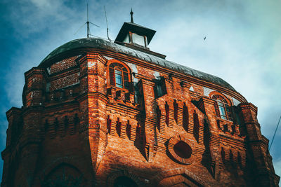 Low angle view of old building against sky