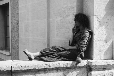 Rear view of a young man looking away