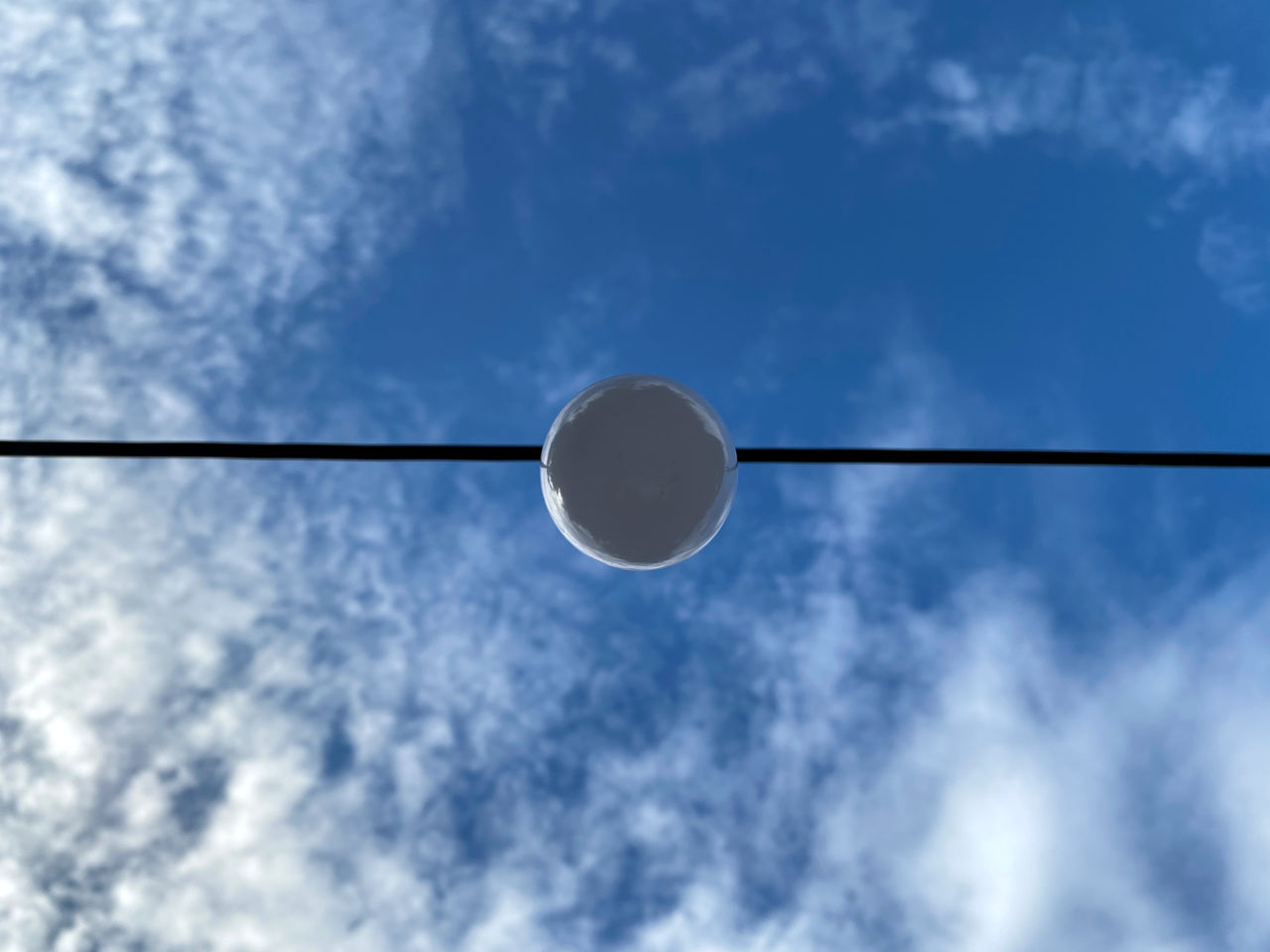 sky, cloud, blue, low angle view, street light, no people, nature, lighting equipment, outdoors, line, light fixture, copy space, electricity, day, technology, directly below