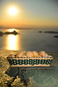 Scenic view of sea shore against sky during sunset