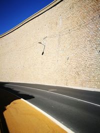 Close-up of road sign on wall