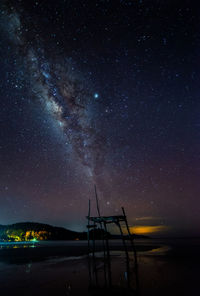 Beach against star field