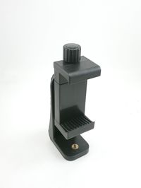 Close-up of telephone booth against white background