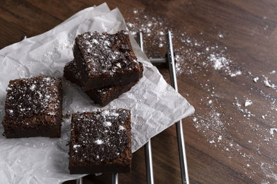 Homemade chocolate brownies on wooden table