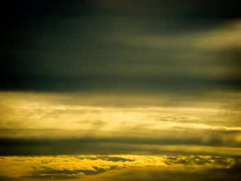 Low angle view of cloudy sky at sunset