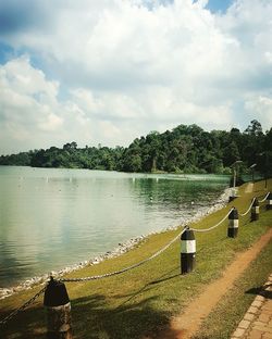 Scenic view of lake against cloudy sky