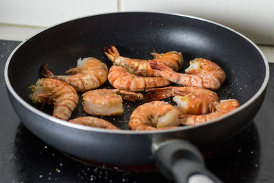 High angle view of meat in cooking pan