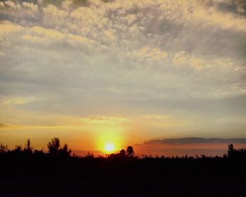 Scenic view of silhouette landscape against sky during sunset