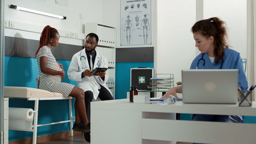 Doctor discussing with patient in medical clinic