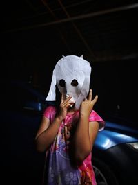 A girl wearing a mask