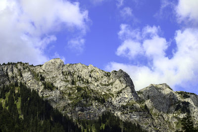 Low angle view of rock formation against sky