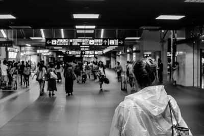 People walking on railroad station platform