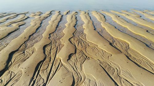 Full frame shot of tire tracks on beach