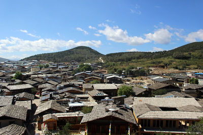 Houses in town against sky