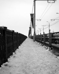 Walkway against clear sky