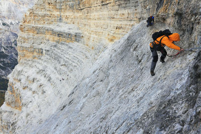 Full length of person climbing mountain