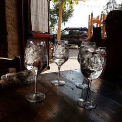 Close-up of wine glasses on table