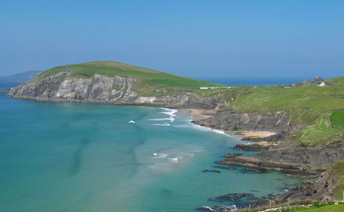 Scenic view of sea against clear blue sky