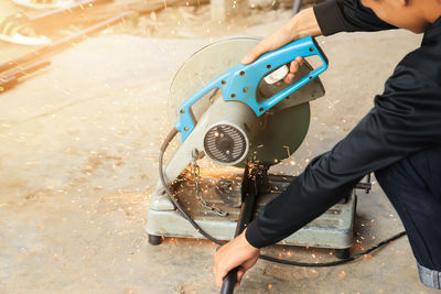 High angle view of man working on street in city