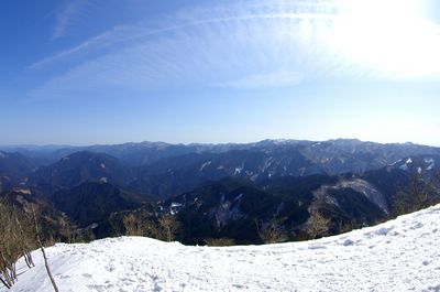 Scenic view of mountains against sky during winter