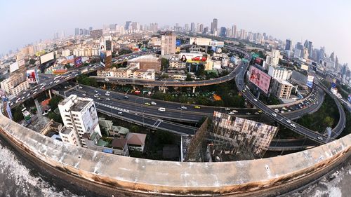 High angle view of city lit up at night