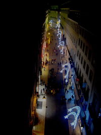 View of illuminated city street at night