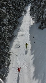 High angle view of hikers on snowfield