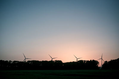 Wind turbines on field