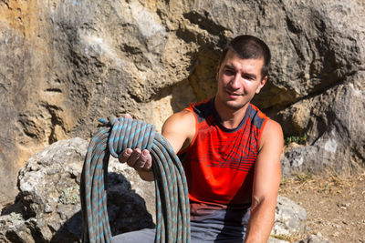 Mid adult man standing on rock
