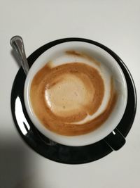 Close-up of coffee cup on table