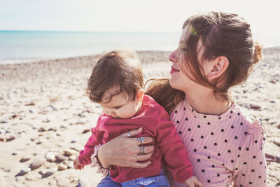 Mother and daughter at beach