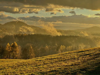 Scenic view of landscape against sky during sunset