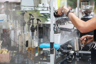 Midsection of man working in factory