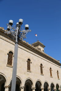 Low angle view of building against blue sky