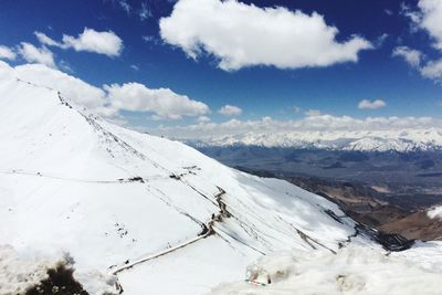 Scenic view of snow covered mountains against sky