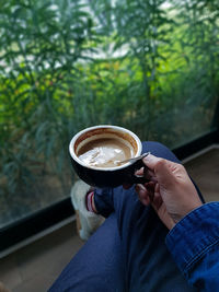 Man holding coffee cup