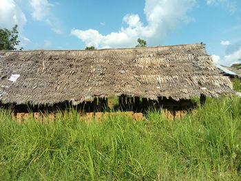 House on field against sky