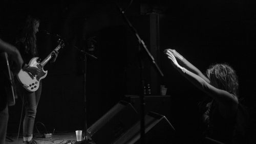 Man playing guitar at night